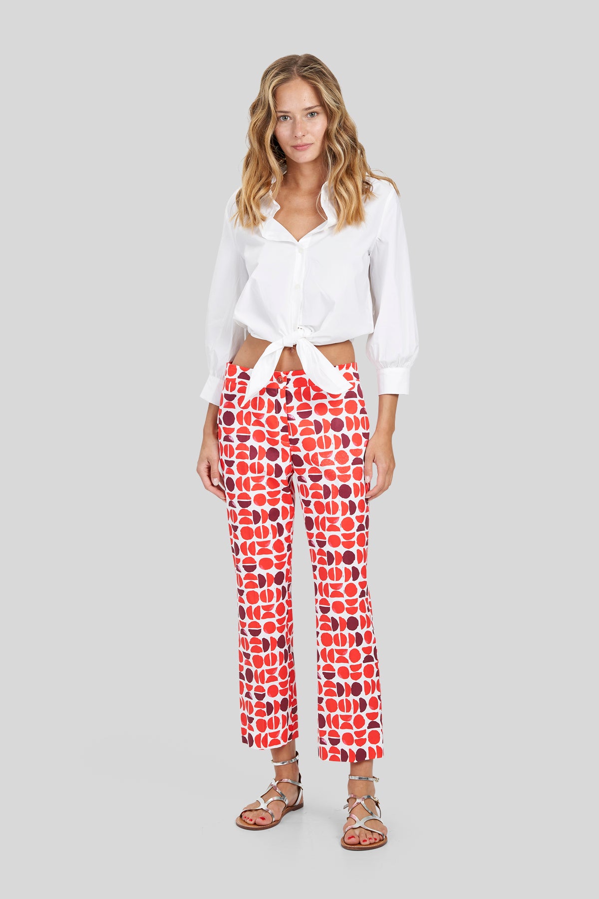 Pantaloni trumpet in gabardina a fantasia
