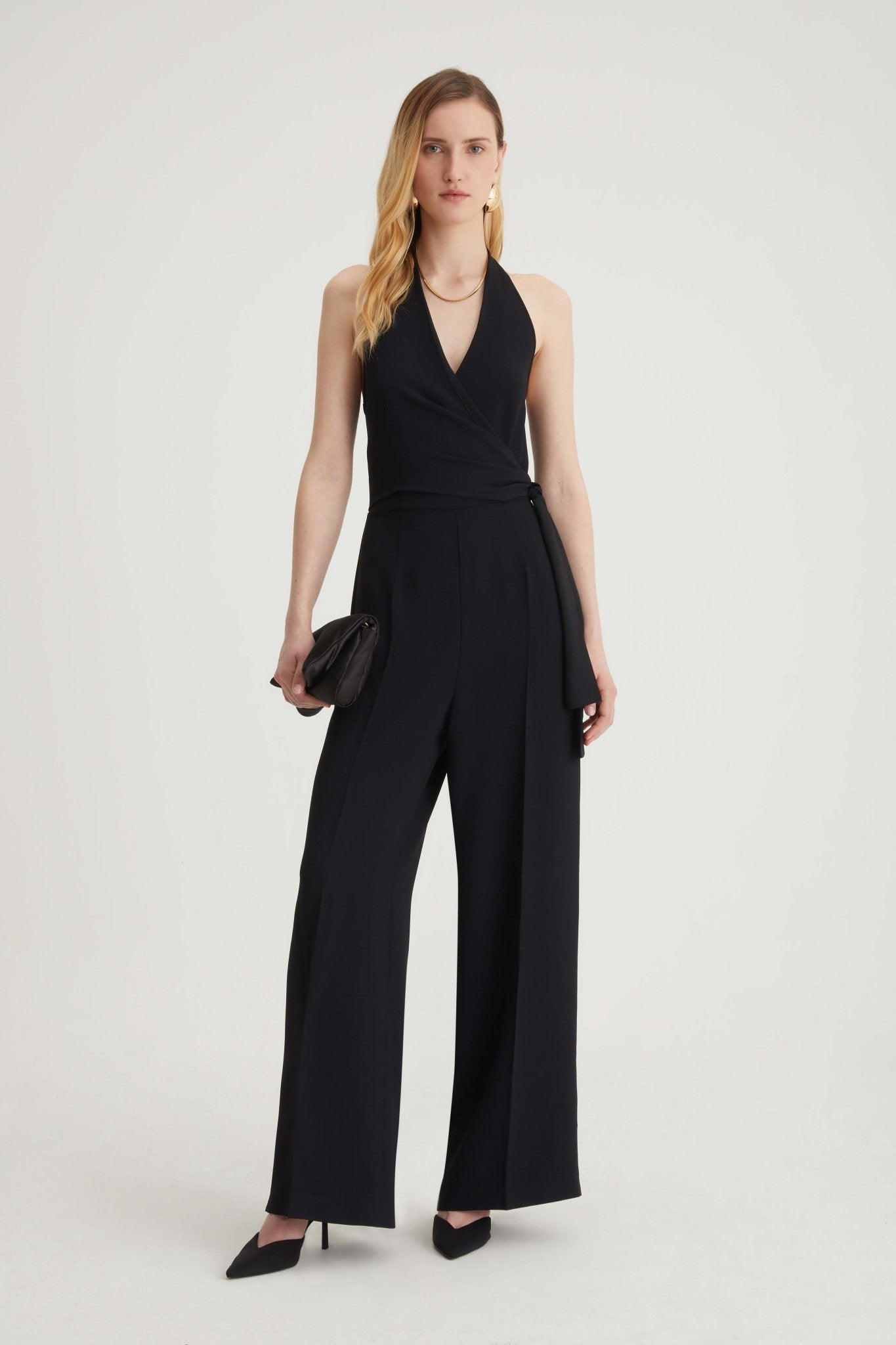 Tuta smanicata con fiocco laterale - Caractère